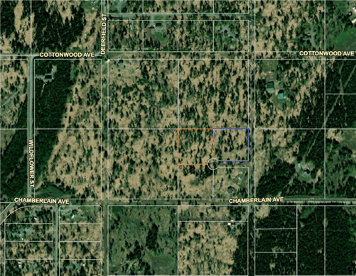 Aerial view of 5.03-acre Talkeetna Bluffs Lot 2 in Matanuska-Susitna Borough, Alaska, with surrounding landscape and natural terrain.