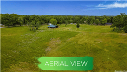 Aerial view of Arkansas Saline County 0.55-acre lot in Hot Spring Village, Lot 3, Block 4, showing surrounding landscape and property boundaries.