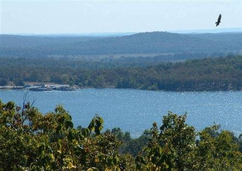 A 0.30-acre land parcel in Horseshoe Bend, Izard County, Arkansas, shown with natural landscape and property boundary.