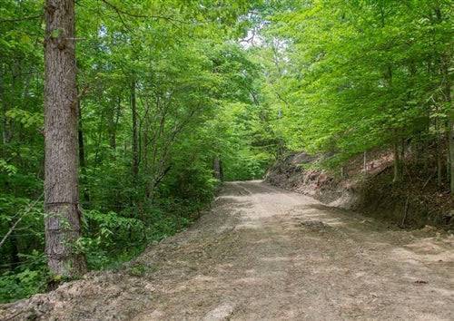 Aerial view of Kentucky Casey County Laurel Ridge 5.22-acre lot, Lot 16, with wooded terrain and open land in Kentucky