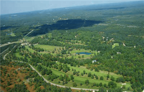 Aerial view of Michigan Antrim County Lake of the North lot 91, 0.31 acres, with nearby electricity and water access.