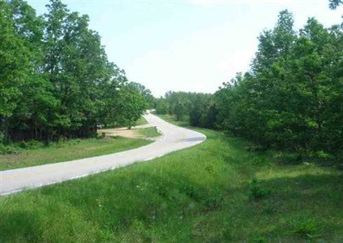 Aerial view of Missouri Dent County Deer Valley 20-acre lot, showcasing wooded terrain and open areas in Deer Valley.