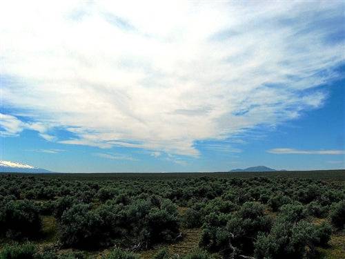 Aerial view of Nevada Elko County Humboldt River Ranchos 2.27-acre property with open land and surrounding natural scenery.