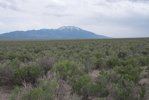 Aerial view of Nevada Elko County 10-acre Charley Creek Lot 9 in Sec 1 TWP 39N RGE 68E, showcasing open land and natural terrain.