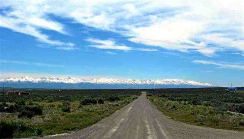 Aerial view of Nevada Meadow Valley Ranchos Lot 1 Unit 5 in Elko County, showing open land and surrounding natural landscape.