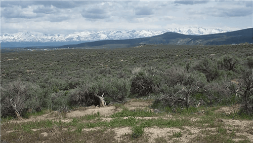 Aerial view of Nevada Elko County Twin River Ranchos Lot 1 Unit 3 Block 8 parcel, showing undeveloped desert landscape and surrounding land.