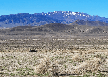 Aerial view of Humboldt County Nevada 41.32-acre lot near Battle Mountain, showing open land and surrounding natural terrain.