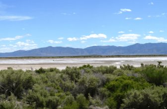 High desert 40-acre Nevada Washoe County land in Gerlach, showcasing open desert terrain and clear blue sky.