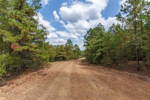 11.48-acre stone bridge lot in Latimer County, Oklahoma, featuring natural landscape and rural scenery on Lot 44.
