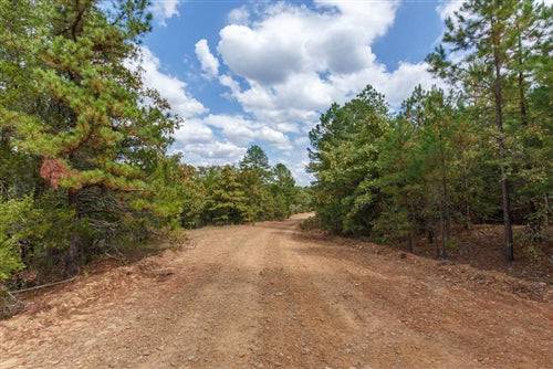 Aerial view of Oklahoma Latimer County 16.40-acre Stone Bridge lot 49, showcasing land and natural surroundings.