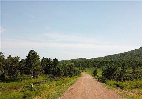 Aerial view of Tyler Stone Ranch Lot 17 in Le Flore County, Oklahoma, showing wooded 4.63-acre land parcel.