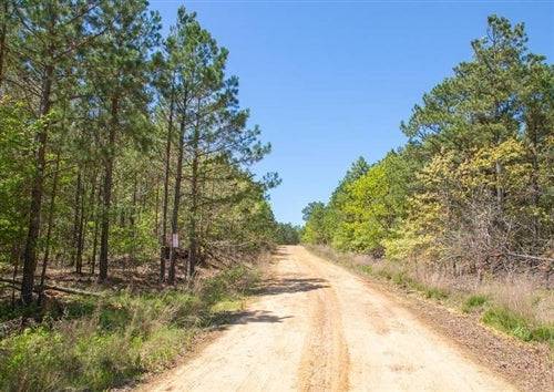 Aerial view of Oklahoma Eagles Nest Ranch lot 22 in Pushmataha County, showcasing wooded 9.21-acre land parcel.