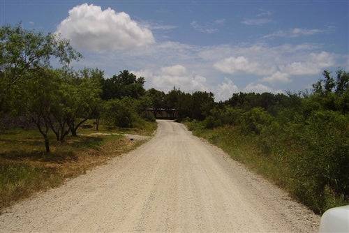 Aerial view of Texas Brown County Indian Trails Lot 91 and 92, 0.3-acre residential land with natural landscape.