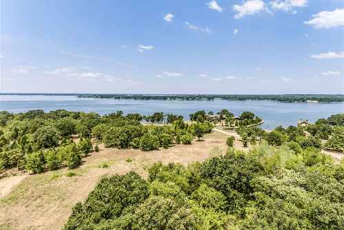 Aerial view of Lot 81 in Beachwood Estates, Cedar Creek Reservoir, Henderson County Texas, showing the wooded lot with nearby water.