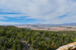 Aerial view of Utah Duchesne County Fruitland 40-acre land parcel with open fields and natural landscape.