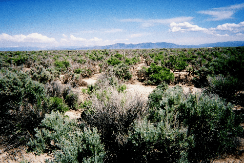 Aerial view of Utah Iron County Beryl Townsite Lot 1166, 2.27 acres, showcasing the undeveloped land and surrounding natural landscape.
