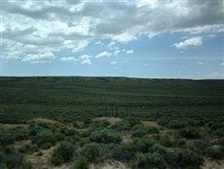 Aerial view of 40-acre Wyoming Sweetwater County land for sale, showing open plains and natural landscape.