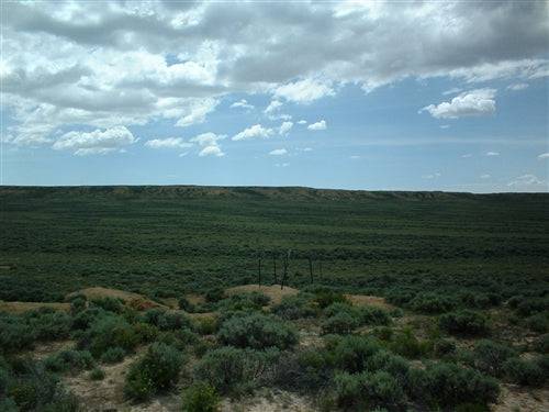 Aerial view of Wyoming Sweetwater County 40-acre land parcel in natural landscape, available for sale with installment terms.
