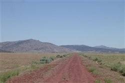 Aerial view of 20.3 acres Moon Valley Ranch in Lassen County, California, featuring open land and scenic natural landscape.