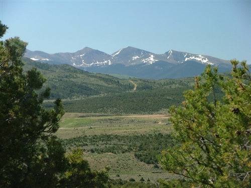 Aerial view of Eagle Ridge Ranch in Costilla County, Colorado, showcasing 91.56 acres of scenic land with mountain and open terrain.
