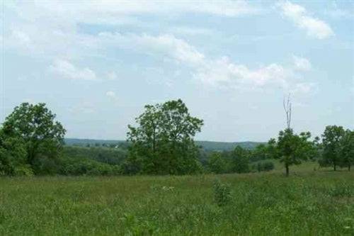 Aerial view of Whispering Oaks Ranch in Texas County, Missouri, showing 5 acres of wooded land with open grassy areas.