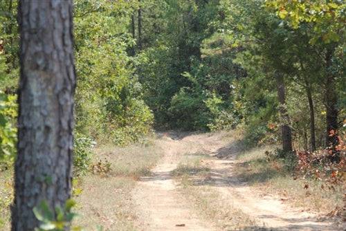 Aerial view of Oklahoma Pushmataha County Lake View Ranch showing 9.36 acres of land with scenic lake surroundings.