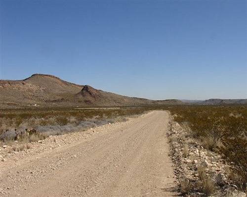 Aerial view of a 47.71-acre Texas property in Brewster County on Terlingua Ranch, showcasing open land and rugged terrain.