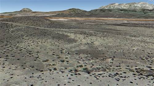 Aerial view of 20-acre Texas land in Brewster County near Terlingua Ranch, showing open desert terrain and rugged landscape.