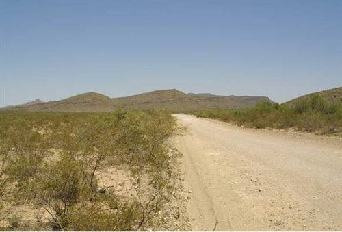 20-acre Sunset Ranches lot in Hudspeth County Texas, scenic desert landscape with open land and distant mountains.