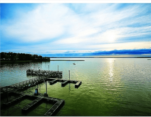 Aerial view of a Texas Polk County Lake Livingston Resort lot, Lot 212, section 14, showcasing surrounding natural landscape.