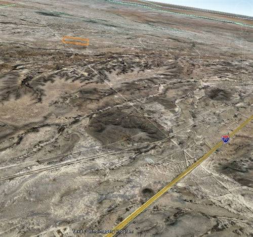 Scenic view of Texas Ward County 36-acre land parcel, with dry terrain and distant horizon, offered by Onlinelandsales.