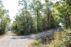 A plot of land in Cherokee Village, Sharp County, Arkansas with electricity and water access, priced at $50/month.