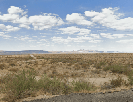 Aerial view of Arizona Mohave County Frontier Valley 3.50-acre lots 199 and 200 in Unit 02, with desert landscape and open sky.