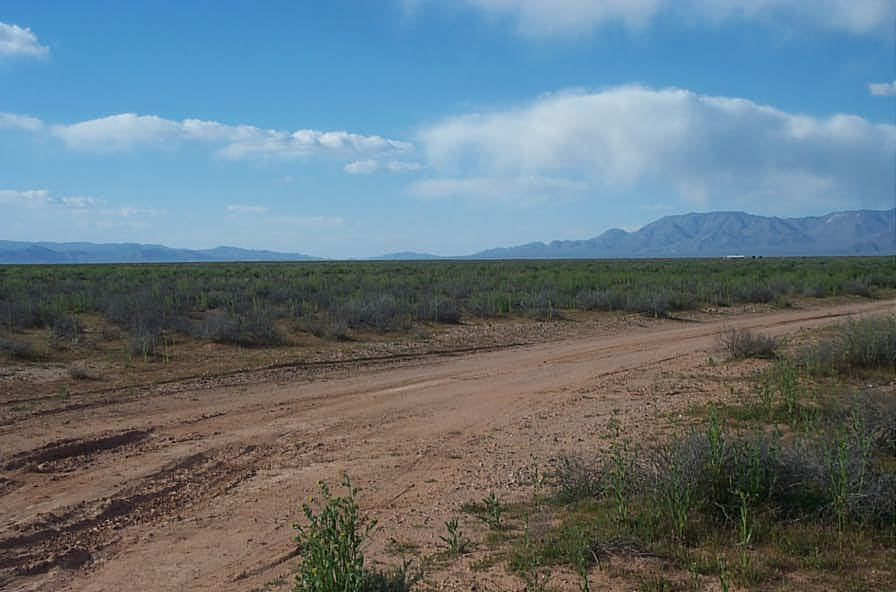 Aerial view of Arizona Mohave County Lake Mead Rancheros Unit 1 Lot 185, showing open land near Lake Mead in desert terrain