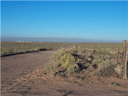 Aerial view of Arizona Navajo County 1.25-acre Rancho Lot 106 with open land and natural desert landscape.