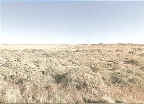 Aerial view of Navajo County, Arizona, 1.25-acre Rancho Lot 47 with desert landscape and open land, offered by Onlinelandsales