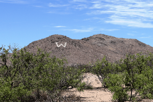 Aerial view of Arizona Bell Ranch Lot 84 in Cochise County, 1-acre property for sale in Arizona, with surrounding desert landscape.