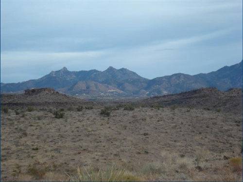 Aerial view of 1.25-acre Lake Mohave Heights land parcel in Mohave County, Arizona, showing surrounding desert landscape.