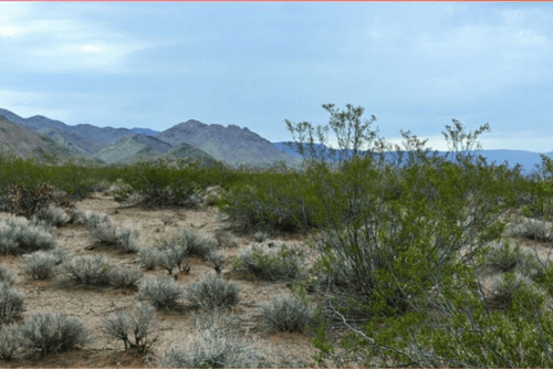 Aerial view of 2.50-acre Lake Havasu land in Mohave County, Arizona, showcasing desert terrain and surrounding natural landscape.