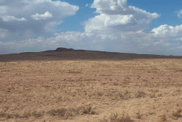 Aerial view of Sun Valley Lot 7 in Navajo County, Arizona, showing undeveloped land with surrounding desert terrain.