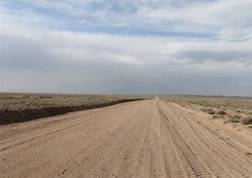 Aerial view of Colorado San Luis Ranches Lot 17 in Costilla County, showing open 5-acre rural land with scenic mountain background.