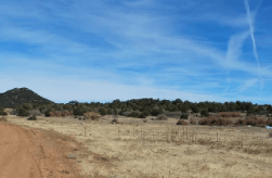 Aerial view of Colorado Fremont County 4.79-acre Florida Acres lot 75 for sale, showing open land and surrounding natural landscape.