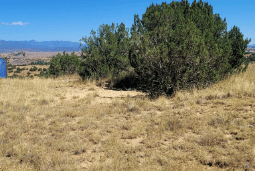 Aerial view of Colorado Fremont County 0.17-acre land near Florence, showing open terrain and surrounding natural landscape.
