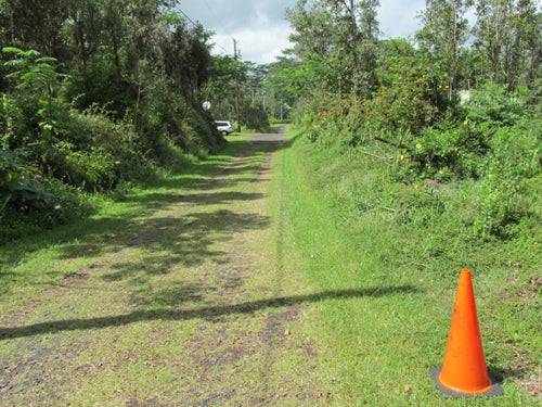 Aerial view of a 0.18-acre Hawaii Nanawale Estates lot near Hilo on Pakalana Road, showing surrounding landscape and property boundaries.