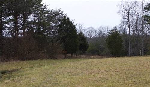 Aerial view of Kentucky Rock Castle County 8.09-acre Majestic Rock Ranch lot with rocky terrain and open land.