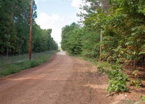 Aerial view of Missouri Dent County Wagon Wheel Ranch Lot 15, 8.62 acres of land with wooded and open areas in Dent County.