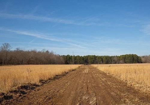 Aerial view of Shannon County Missouri, 6.64-acre O'Connor Crossing Lot 16, with surrounding wooded land and rural landscape.