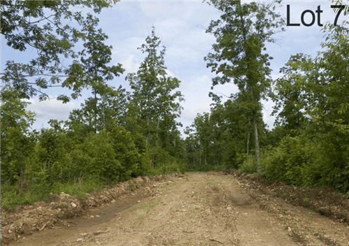 Aerial view of Missouri Thunder Mountain Ranch lot 7 in Shannon County, 5.01 acres with electricity, scenic mountain landscape.