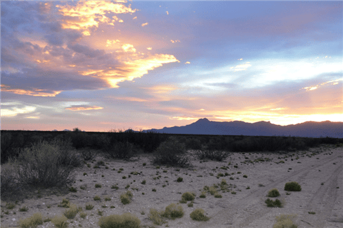 Aerial view of Luna County, New Mexico, Deming Ranchettes Lot 24, 0.50-acre land parcel with natural desert landscape.