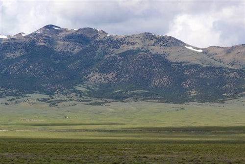 Aerial view of Nevada Elko County Mountain Meadow Ranches, 10-acre land parcel in T40N R68E Section 33, scenic mountain landscape.